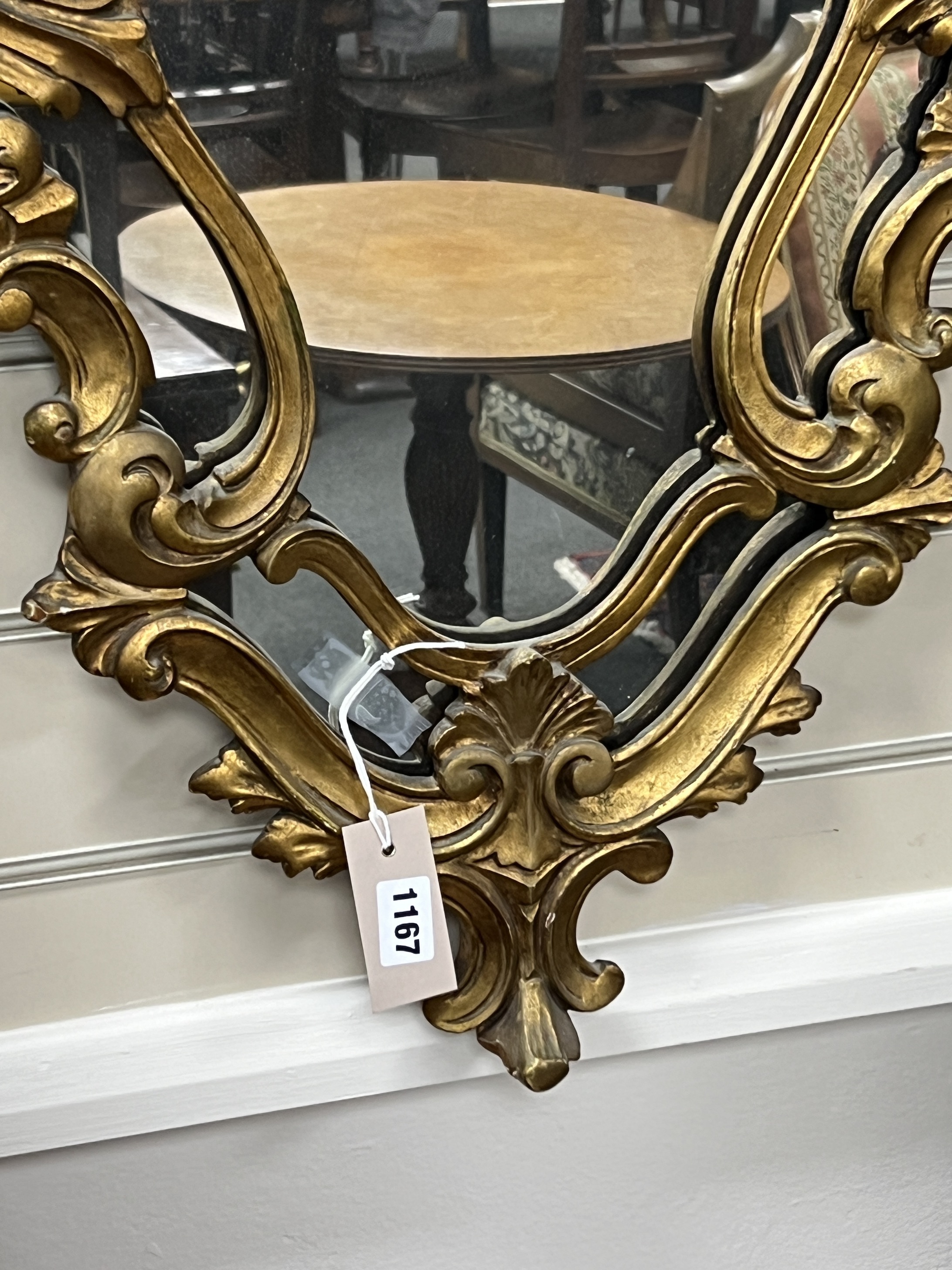 An 18th century style carved wood cartouche wall mirror, width 49cm, height 76cm